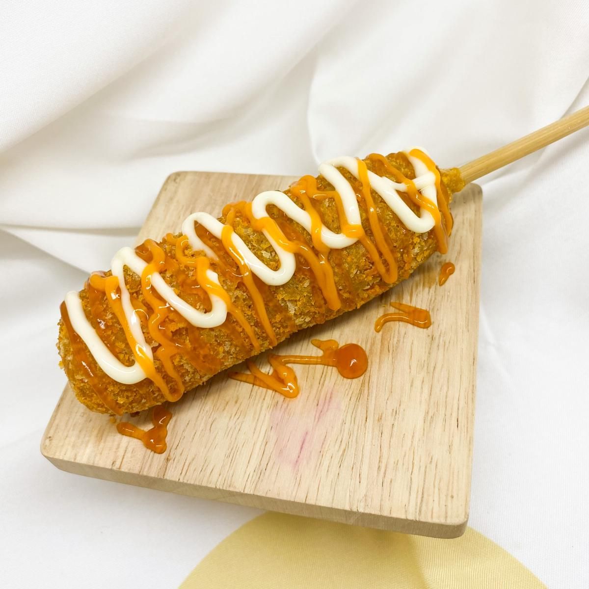 medium-vecteezy_crispy-corn-dog-with-yummy-sauces_21144254_medium.jpg