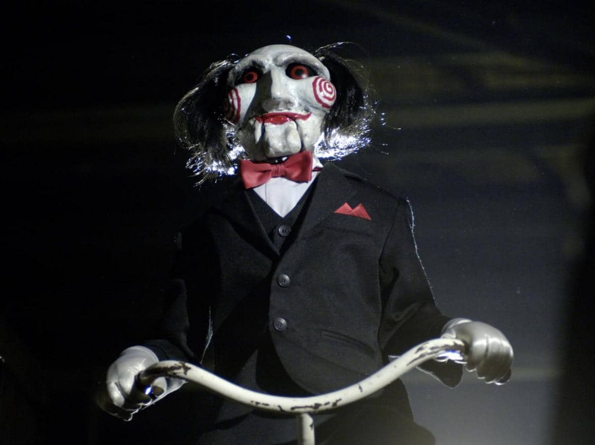 Billy the puppet Jigsawhttps://m.imdb.com/title/tt0387564/mediaviewer/rm3068836096/?ref_=ttmi_mi_1_2