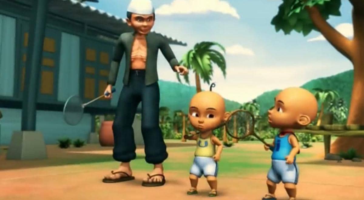 Tok Dalang mengajari Upin dan Ipin cara bermain bulu tangkis. 