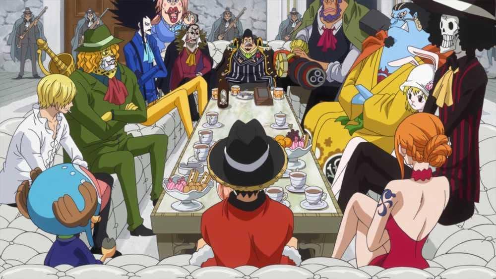 Para karakter anime One Piece duduk mengelilingi meja panjang di ruang makan dalam adegan dari arc Whole Cake Island.