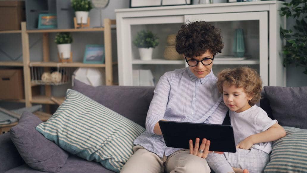 Parents and kid using tablet
